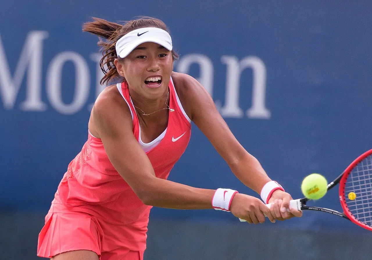 Chinese tennis player Zhang Shuai hitting a backhand on a tennis court